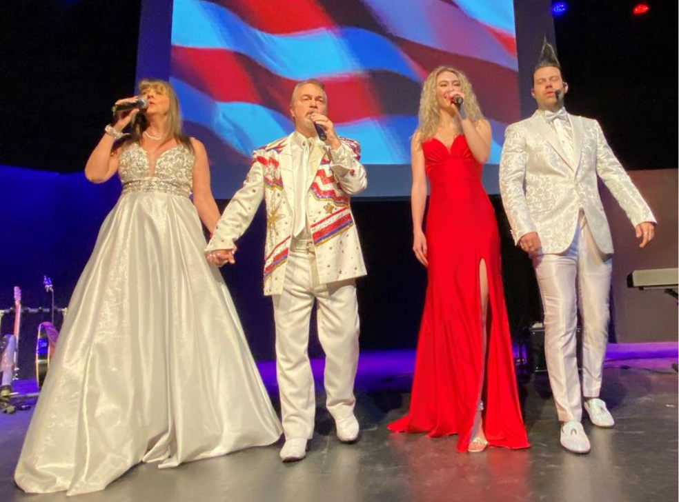 Concert performers performing on stage.