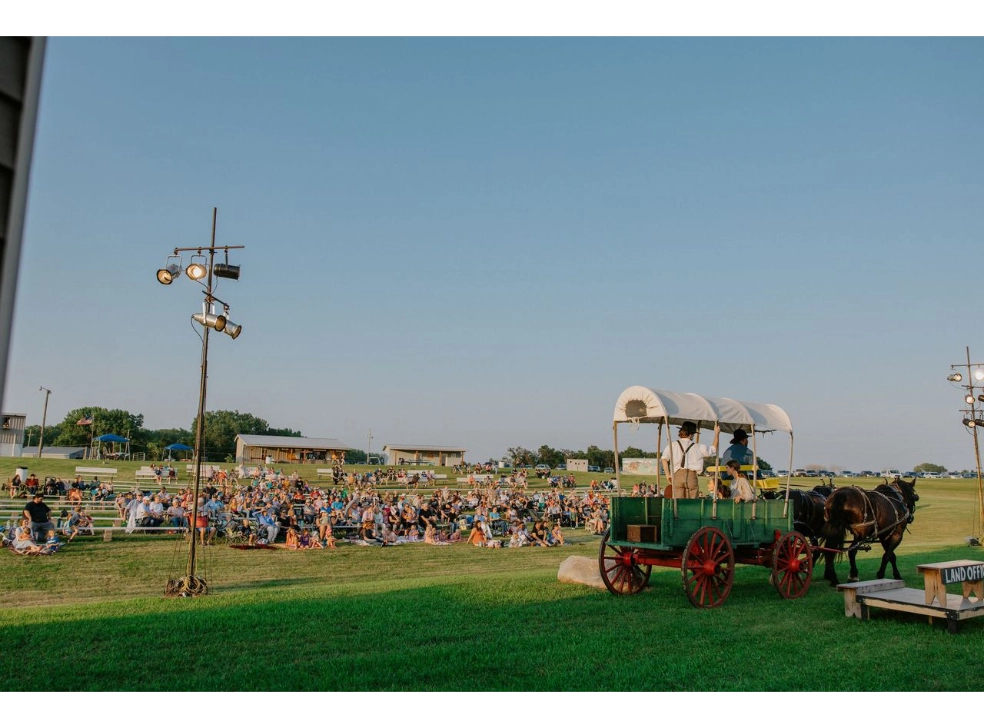 Crowd facing the stage watching the pageant.