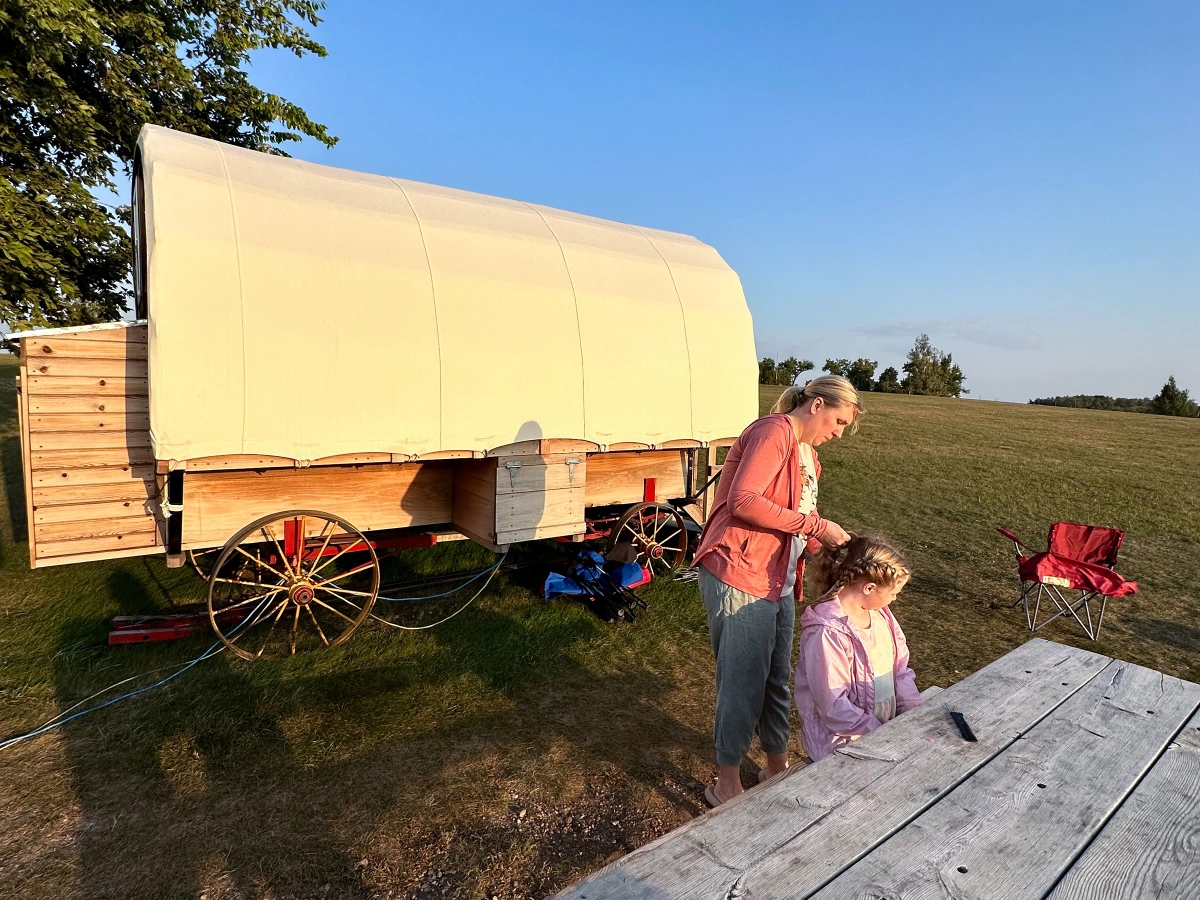 Covered wagon in campground.
