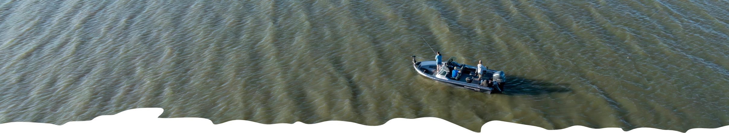 Boat with fisherman on the lake.