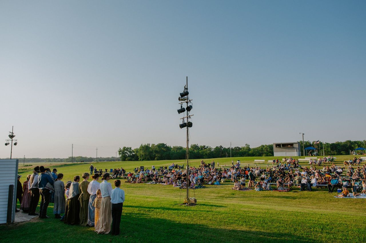 Pageant participants looking towards the crowd.